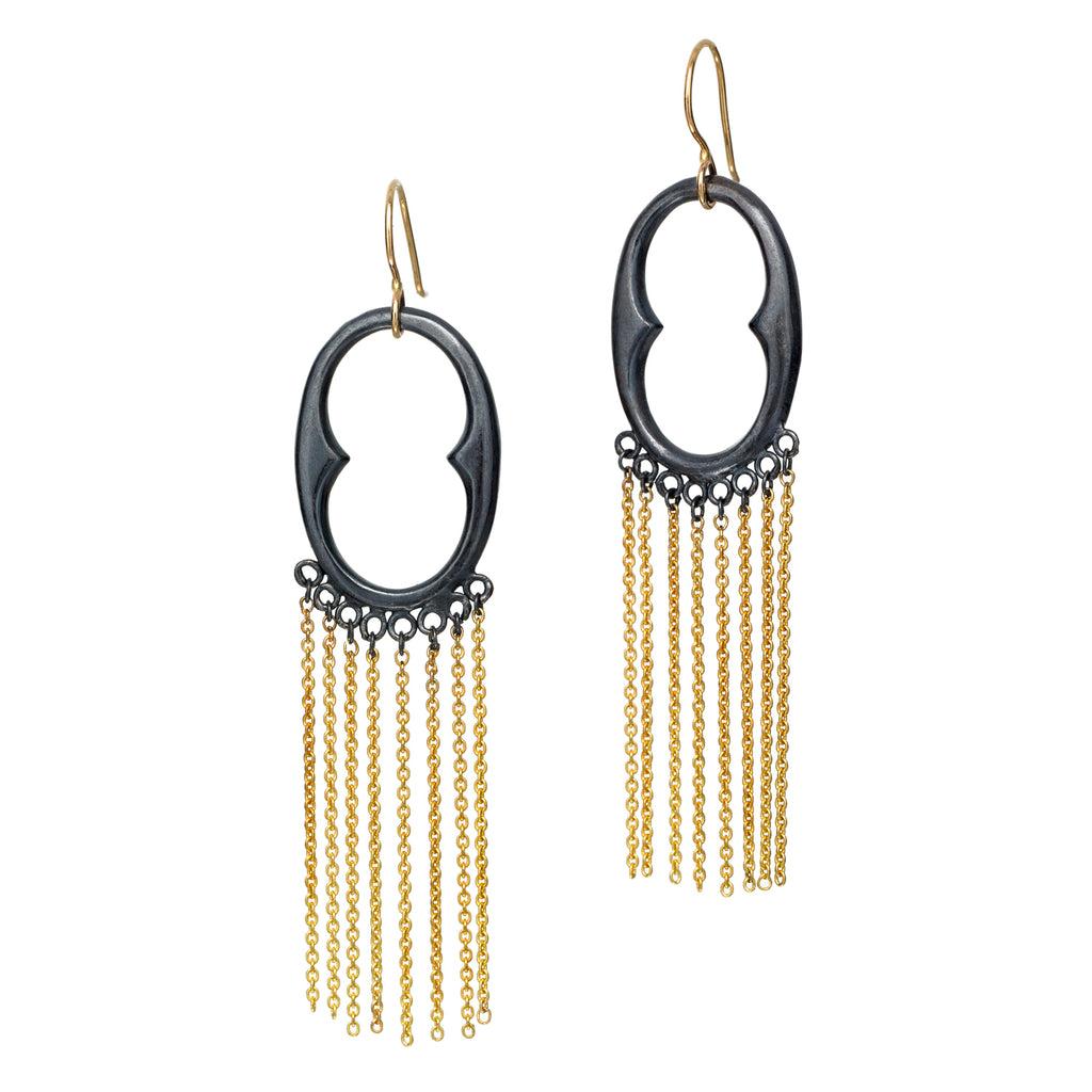 The InsideOut earrings in blackened sterling silver showcase a vibrant touch of 18k yellow gold with a fun fringe, creating a fluid and artistic design. These earrings blend elegance with a playful edge, perfect for adding a touch of flair to any outfit.  • Blackened sterling silver, 18k yellow gold  • Length: 3"