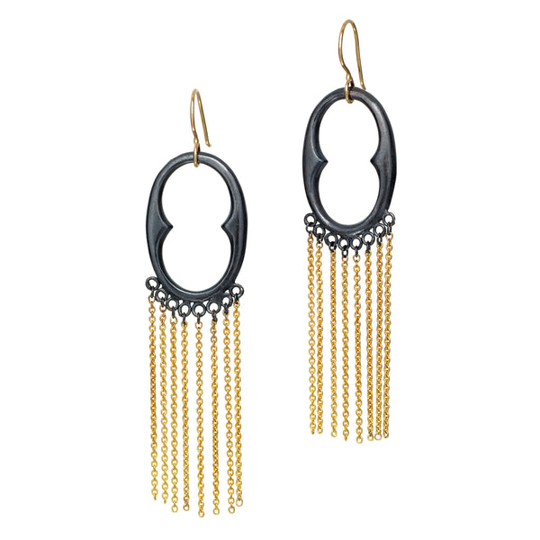 The InsideOut earrings in blackened sterling silver showcase a vibrant touch of 18k yellow gold with a fun fringe, creating a fluid and artistic design. These earrings blend elegance with a playful edge, perfect for adding a touch of flair to any outfit.  • Blackened sterling silver, 18k yellow gold  • Length: 3"