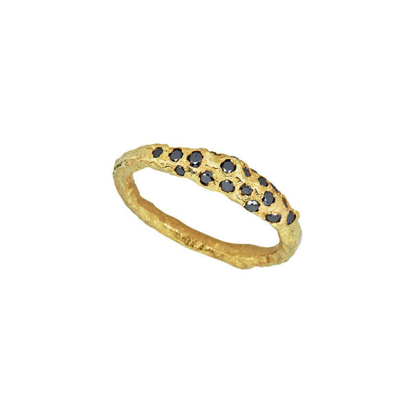 The That Place in Between ring, crafted in 18k yellow gold with black diamonds, is a stunning addition to everyday attire.