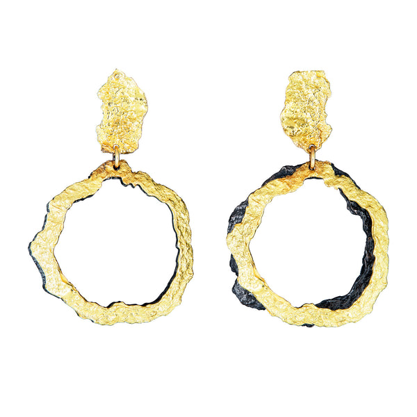 The That Place in Between earrings, crafted in 18k yellow gold and blackened sterling silver, exhibit a playful and artistic design.  • 18k yellow gold, blackened sterling silver  • Posts  • Length: 1.5"