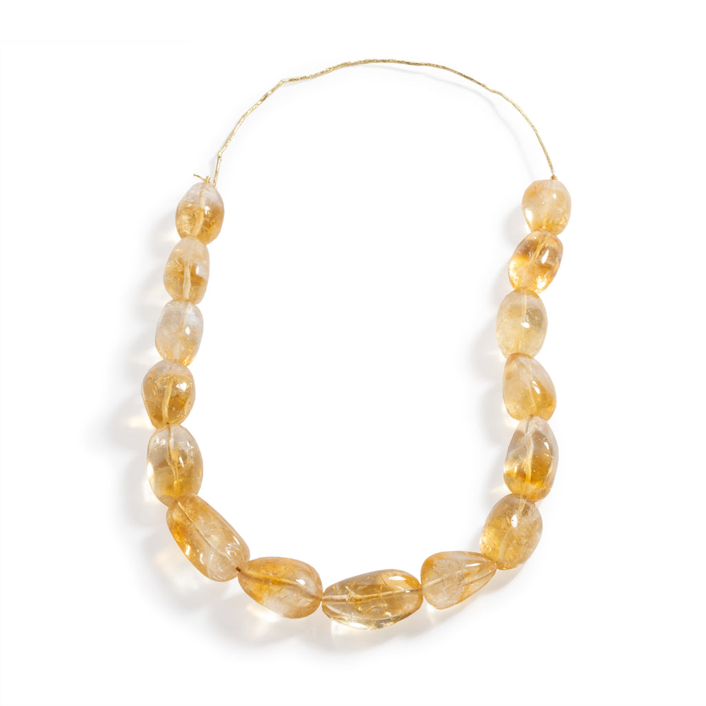 Good Vibes Citrine Necklace by Emanuela Duca - A necklace featuring stunning yellow-orange citrine stones, secured elegantly behind the neck with a contemporary textured bar crafted from 18K yellow gold. This piece radiates sophistication and warmth, making it an essential addition to any jewelry collection. One of a kind.