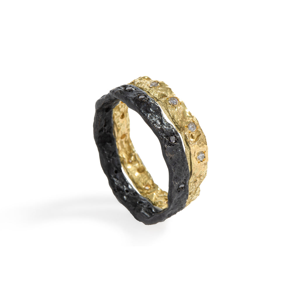 The Mystic Black & Gold Ring by Emanuela Duca - The Mystic Ring, crafted in 18k yellow gold and blackened sterling silver, adorned with a total of 13 white diamonds (1.5mm) and 13 black diamonds (1.5mm). This design marries elegance and sophistication with an edgy allure. It's a ring that makes a bold statement, speaking volumes about style and individuality