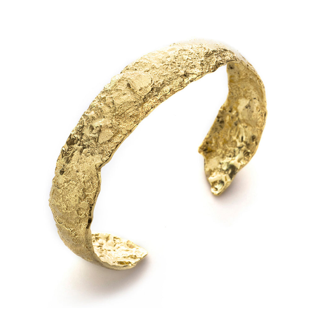 Roccia 18k Gold Cuff Bracelet by Emanuela Duca. The ragged surface of 18k yellow gold exudes raw elegance, coupled with an earthy sophistication. It's a testament to the beauty found in imperfection/perfection of natural forms.