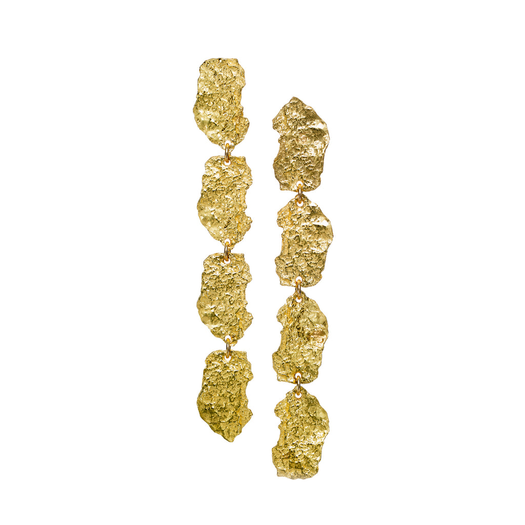 The Burst earrings in 18k yellow gold feature four textured elements on each earring, seamlessly connected to one another with a jump ring. Secured by posts and backs, this elongated design resonates with both fashion and artistic expression.  • 18k yellow gold  • Posts backs  • Length: 2.5"